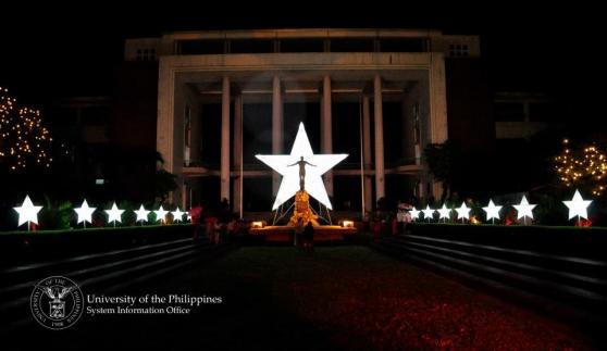Photo by:Jun Madrid.This was last year's photo of the Quezon hall.But it exactly looked like this except the columns of the building at the back were not yet decorated.Strings of christmas lights drape on the columns.